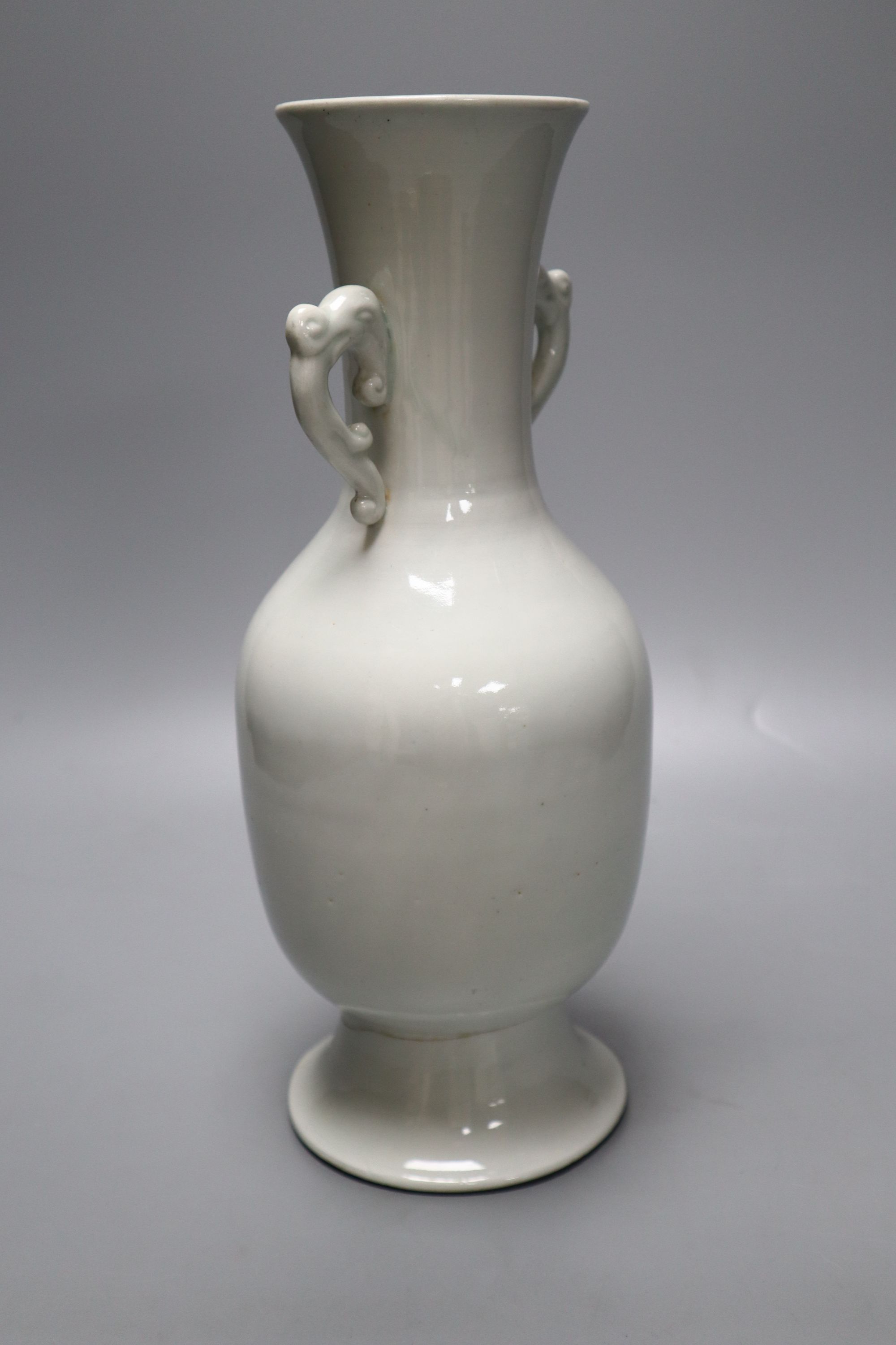 A Chinese white glazed porcelain two handled vase, height 29cm (a.f.)